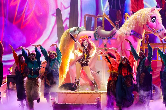 Chappell Roan <a  target="_top" href="/newspapers?url=https://www.cnn.com/entertainment/live-news/the-grammys-award-show-02-2-25#cm6odd4lm000p3b6mtw4ibxpt">performs her popular hit “Pink Pony Club"</a> in her debut Grammy performance.