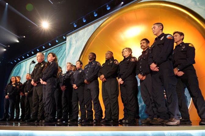 Members of the Los Angeles County Fire Department are <a  target="_top" href="/newspapers?url=https://www.cnn.com/entertainment/live-news/the-grammys-award-show-02-2-25#cm6ok11wx00333b6ma1k3f6zb">honored on stage</a> before the final Grammy was awarded. They received a standing ovation.