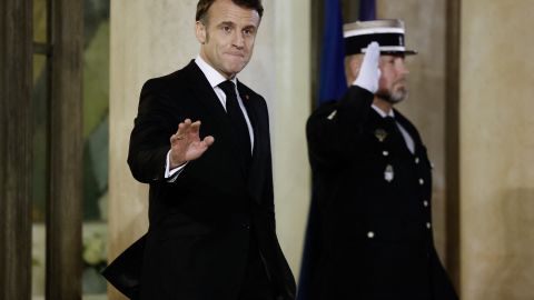 's President Emmanuel Macron waves prior to a work dinner at the Elysee Palace in Paris, on February 6, 2025. (Photo by Ludovic MARIN / AFP) (Photo by LUDOVIC MARIN/AFP via Getty Images)          