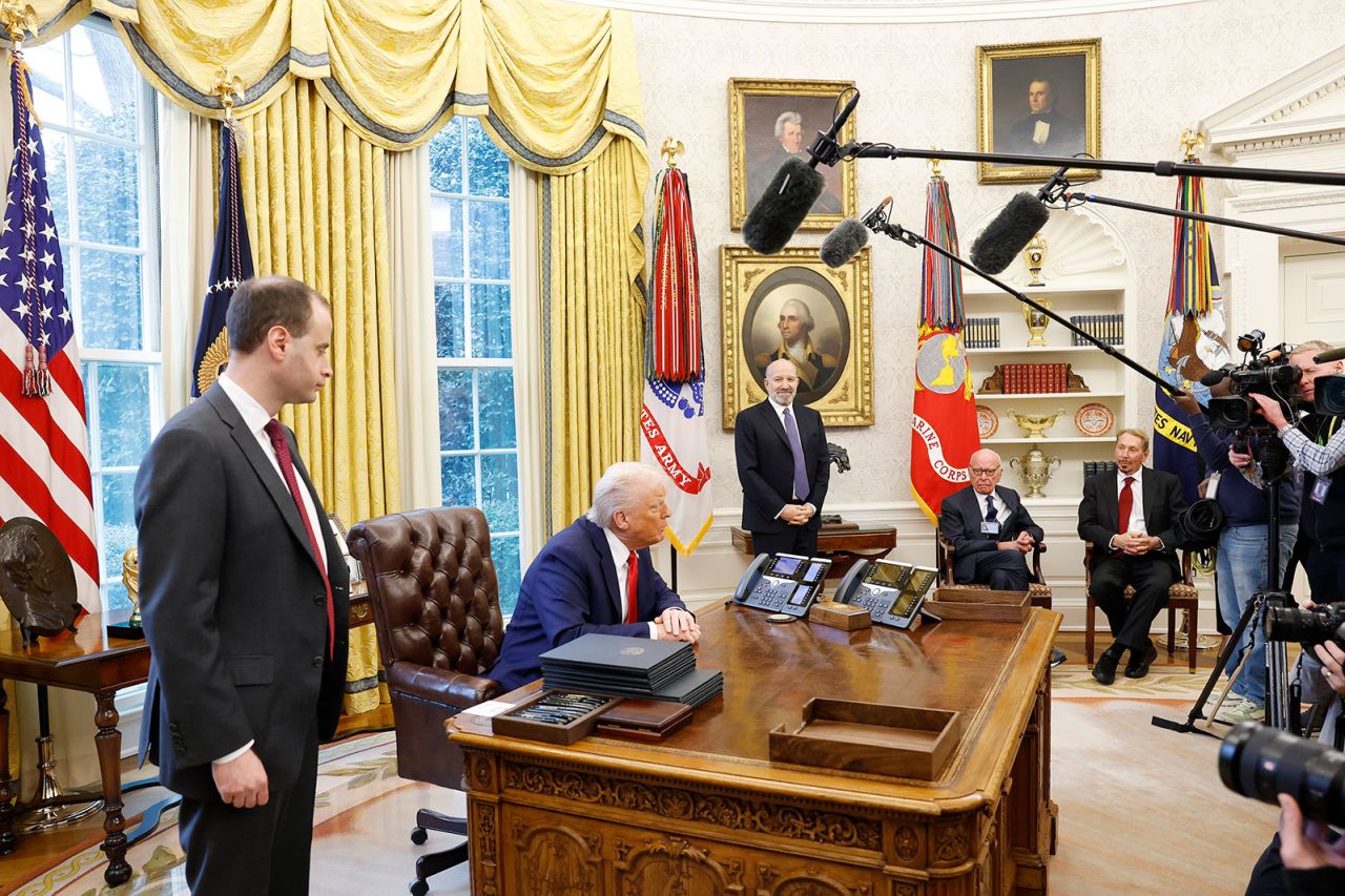 President Donald Trump speaks to reporters in the Oval Office on Monday, after signing a series of executive orders and proclamations.