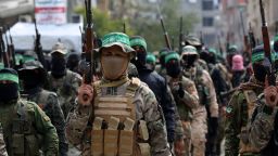 Palestinian fighters from the Ezzedine al-Qassam Brigades, the armed wing of Hamas, take part in the funeral procession of Marwan Issa, a top Hamas commander killed in March 2024, in the war-devastated Bureij refugee camp in the central Gaza Strip on February 7, 2025. (Photo by Eyad BABA / AFP) (Photo by EYAD BABA/AFP via Getty Images)          