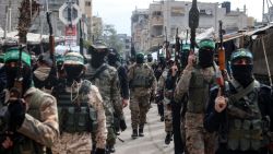 Palestinian fighters from the Ezzedine al-Qassam Brigades, the armed wing of Hamas, take part in the funeral ceremony of Marwan Issa, a top Hamas commander killed in March 2024,  in the war-devastated Bureij refugee camp in the central Gaza Strip on February 7, 2025. (Photo by Eyad BABA / AFP) (Photo by EYAD BABA/AFP via Getty Images)          