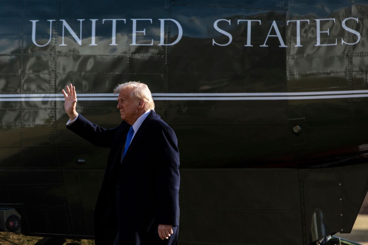 US President Donald Trump walks on the South Lawn of the White House on Friday.