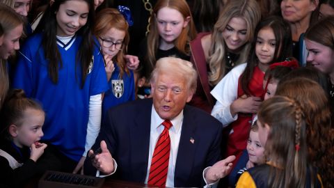 WASHINGTON, DC - FEBRUARY 05: U.S. President Donald Trump ed by women athletes signs the “No Men in Women’s Sports” executive order in the East Room at the White House on February 5, 2025 in Washington, DC. The executive order, which Trump signed on National Girls and Women in Sports Day, prohibits transgender women from competing in women’s sports and is the third order he has signed that targets transgender people. (Photo by Andrew Harnik/Getty Images)
