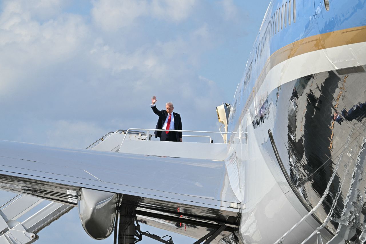 President Donald Trump boards Air Force One at Palm Beach International Airport in West Palm Beach, Florida, on Sunday.