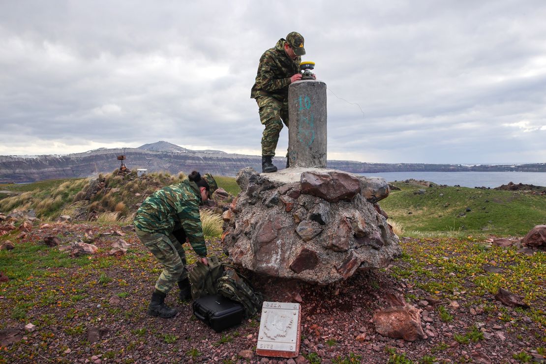 Experts and members of the military investigate seismic activity at Nea Kameni, an uninhabited island adjacent to Santorini.