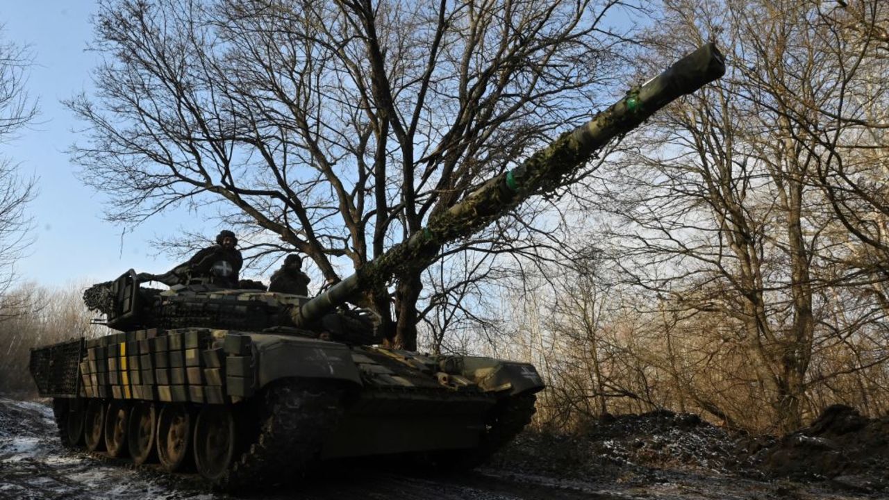 Ukrainian servicemen of the 3rd Tank Brigade of the Ukrainian Ground Forces ride atop a T-72 tank at an undisclosed location in Kharkiv region on February 10, 2025, amid the Russian invasion of Ukraine. (Photo by SERGEY BOBOK / AFP) (Photo by SERGEY BOBOK/AFP via Getty Images)          