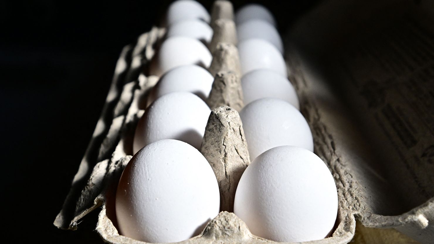 A dozen eggs are seen in a carton on February 10, 2025 in Monterey Park, California. A resurgence of avian flu, which struck the US in 2022, is hitting chicken farms hard, sending egg prices soaring and rattling consumers accustomed to buying this dietary staple for only a few dollars.