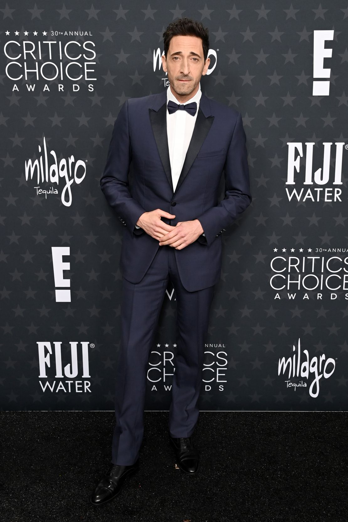 Best actor -nominated Adrien Brody looked Suave in a navy blue tuxedo by Dior Men.