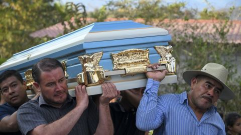 People carry the coffin of one of the victims of a bus accident at the cemetery of Santo Domingo Los Ocotes village in San Antonio La Paz, Guatemala on February 11, 2025. More than 50 people were killed on Monday when a bus crashed through a guard rail and plunged into a ravine, rescuers said, one of the worst road accidents in Latin America in years. (Photo by Johan ORDONEZ / AFP) (Photo by JOHAN ORDONEZ/AFP via Getty Images)
