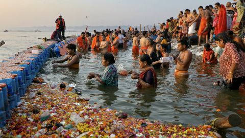 Pilgrims take a holy dip in Sangam, the confluence of Ganges, Yamuna and mythical Saraswati rivers, on the occasion of Maghi Purnima during the Maha Kumbh Mela festival in Prayagraj on February 12, 2025. (Photo by Niharika KULKARNI / AFP) (Photo by NIHARIKA KULKARNI/AFP via Getty Images)          