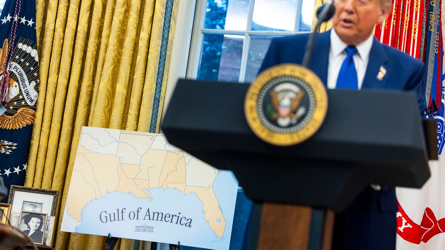A Gulf of America sign behind US President Donald Trump during a swearing-in ceremony for Tulsi Gabbard, US director of National Intelligence, not pictured, in the Oval Office of the White House in Washington, DC on Wednesday, February 12, 2025.
