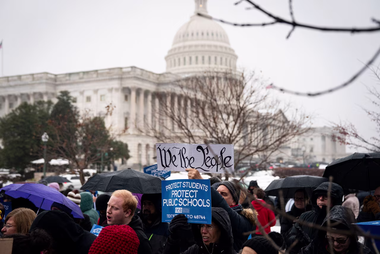 People protest against the nomination of Linda McMahon to serve as President Donald Trump education secretary, outside the US Capitol on Wednesday.