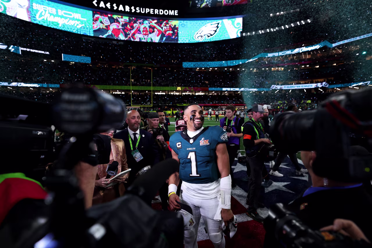 Quarterback Jalen Hurts smiles after the game.