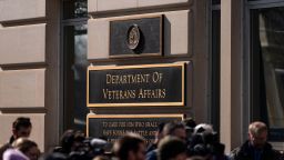 Members of the media stand near a rally outside the Department of Veterans Affairs headquarters in Washington, DC, on Thursday, Feb. 13, 2025.