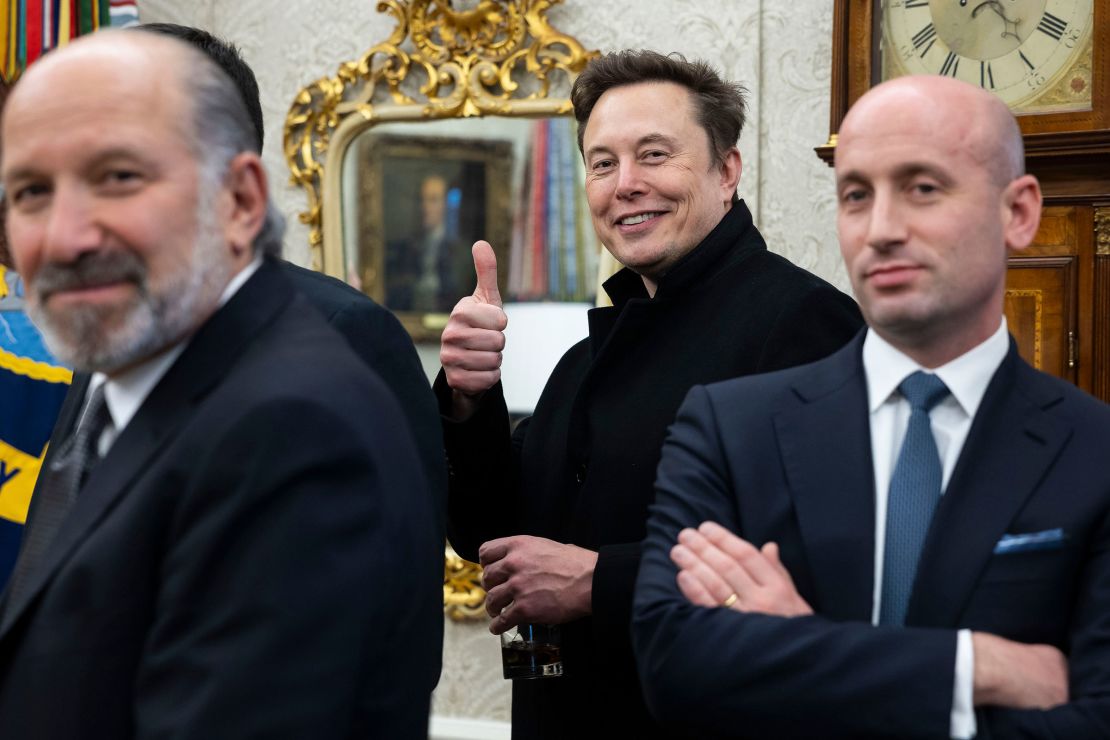 Elon Musk, center, and Stephen Miller, right, during a meeting in the Oval Office on Thursday, Feb. 13, 2025.