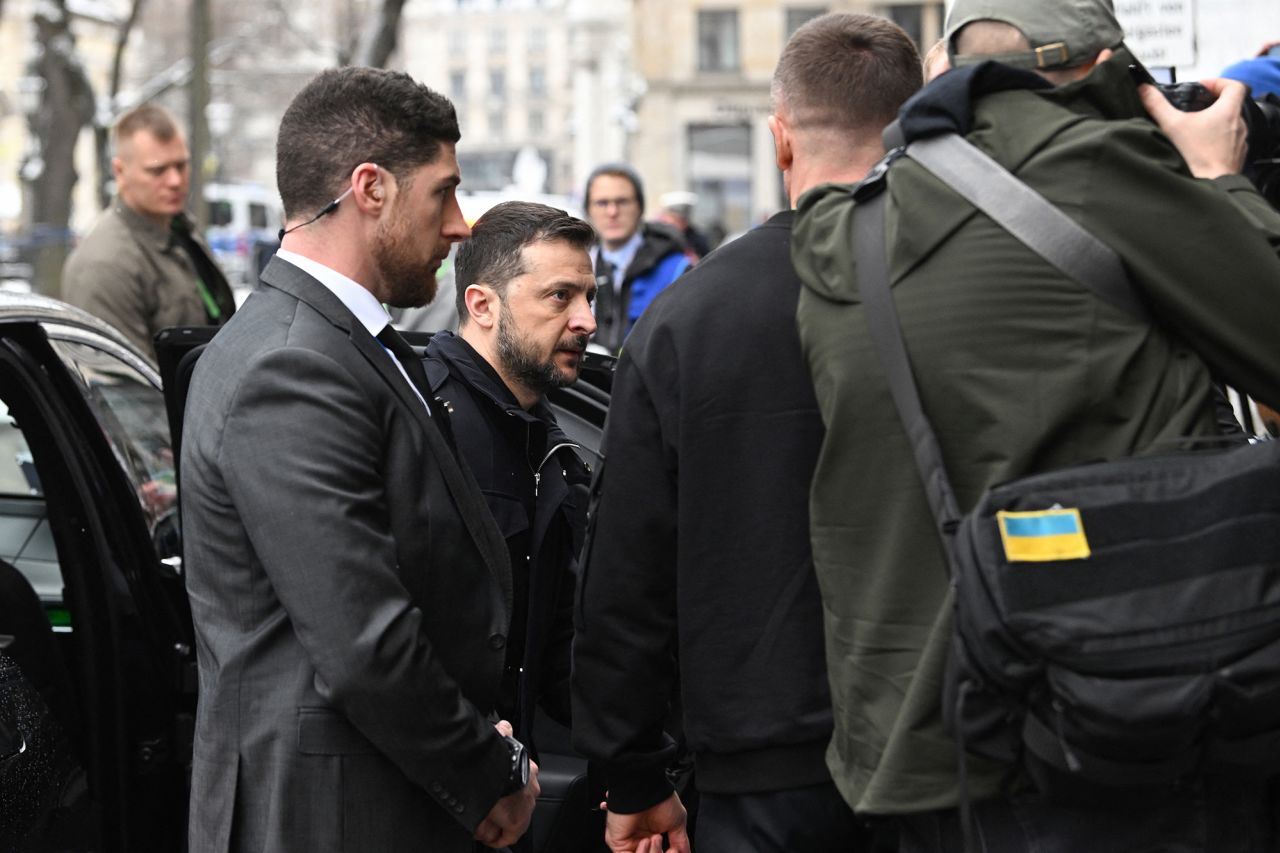 Ukrainian President Volodymyr Zelensky, center, arrives at the 61st Munich Security Conference in Munich, Germany, on Friday.