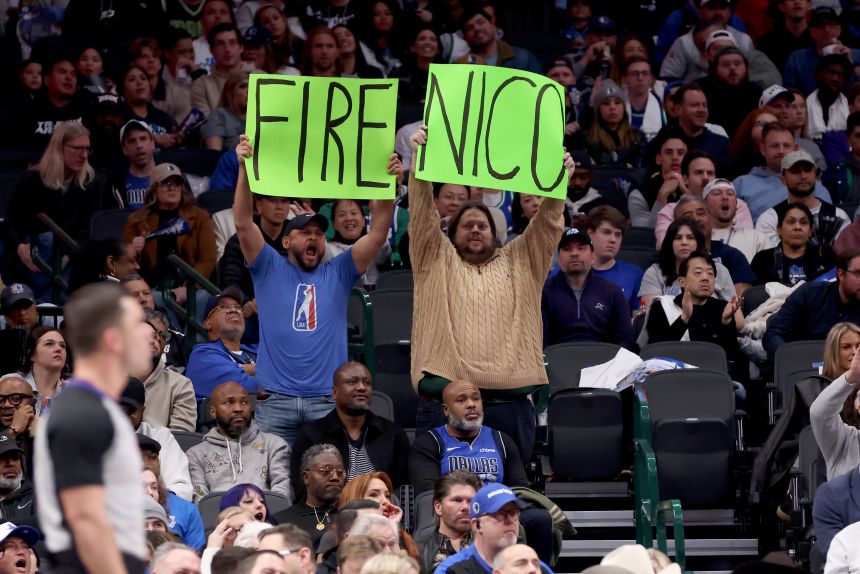 Dallas Mavericks fans hold up a sign referring to Mavs general manager Nico Harrison during the game against the Sacramento Kings at American Airlines Center on February 10.