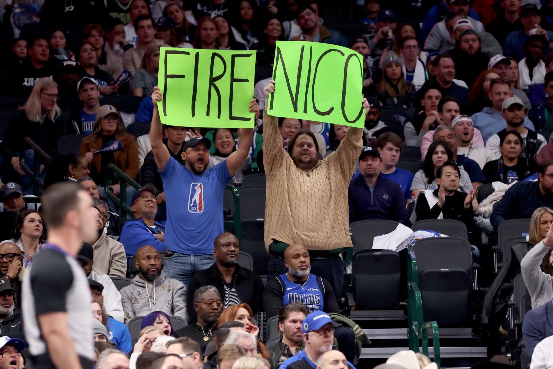Dallas fans hold up a sign referring to Mavs general manager Nico Harrison during the game against the Sacramento Kings at American Airlines Center on February 10.