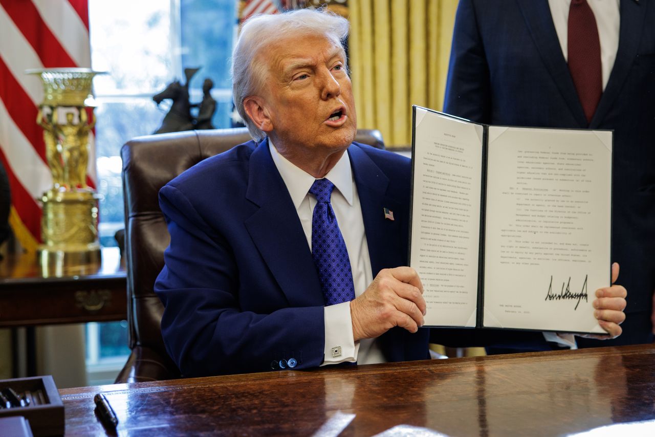 US President Donald Trump speaks during an executive order signing in the Oval Office of the White House in Washington, DC, US, on Friday, Feb. 14, 2025. The Trump administration is laying off 1,300 employees at the Centers for Disease Control and Prevention, shrinking the public health agency as part of an effort to cut costs across the federal government. Photographer: Samuel Corum/Sipa/Bloomberg via Getty Images