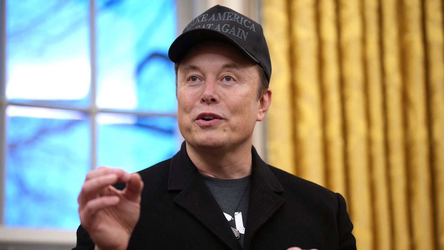 Elon Musk delivers remarks as he joins U.S. President Donald Trump during an executive order signing in the Oval Office at the White House on February 11, 2025.