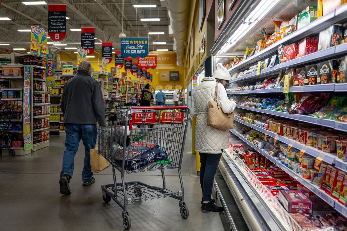 Customers shop for produce at an H-E-B grocery store on February 12 in Austin.