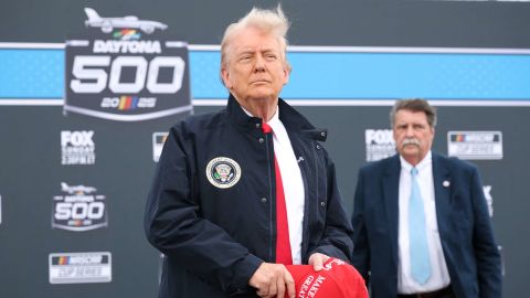 US President Donald Trump stands during the national anthem prior to to the NASCAR Cup Series Daytona 500 at Daytona International Speedway on February 16, 2025 in Daytona Beach, Florida. (Photo by Chris Graythen / POOL / AFP) (Photo by CHRIS GRAYTHEN/POOL/AFP via Getty Images)