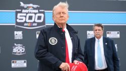 US President Donald Trump stands during the national anthem prior to to the NASCAR Cup Series Daytona 500 at Daytona International Speedway on February 16, 2025 in Daytona Beach, Florida. (Photo by Chris Graythen / POOL / AFP) (Photo by CHRIS GRAYTHEN/POOL/AFP via Getty Images)