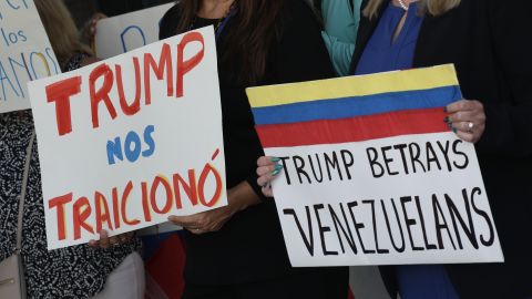 MIAMI, FLORIDA - FEBRUARY 13: People stand together to a resolution in favor of reinstating temporary protected status for Venezuelans on February 13, 2025 in Miami, Florida. In early February, President Donald Trump's istration revoked temporary protected status for around 350,000 Venezuelans who fled the country and immigrated to the United States. (Photo by Joe Raedle/Getty Images)