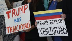 MIAMI, FLORIDA - FEBRUARY 13: People stand together to  a resolution in favor of reinstating temporary protected status for Venezuelans on February 13, 2025 in Miami, Florida. In early February, President Donald Trump's istration revoked temporary protected status for around 350,000 Venezuelans who fled the country and immigrated to the United States. (Photo by Joe Raedle/Getty Images)