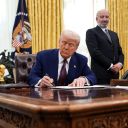 U.S. President Donald Trump, joined by Secretary of Commerce Howard Lutnick, signs an executive order on reciprocal tariffs in the Oval Office at the White House on February 13, 2025 in Washington, DC. Trump announced his plan to increase U.S. tariffs to match the rates other nations charge to import American goods.