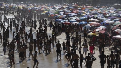 People enjoy the day at Copacabana beach in Rio de Janeiro, Brazil, on February 16, 2025. (Photo by Pablo PORCIUNCULA / AFP) (Photo by PABLO PORCIUNCULA/AFP via Getty Images)          