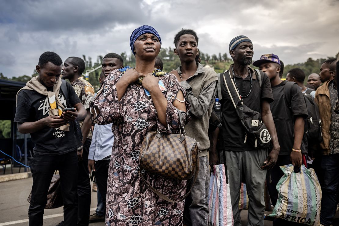 Congolese families displaced by ongoing clashes in eastern Democratic Republic of Congo line up as they wait for Rwandan police and immigration officials to allow them to return to the country, following the takeover of the Congolese city of Bukavu by the M23 movement in February.