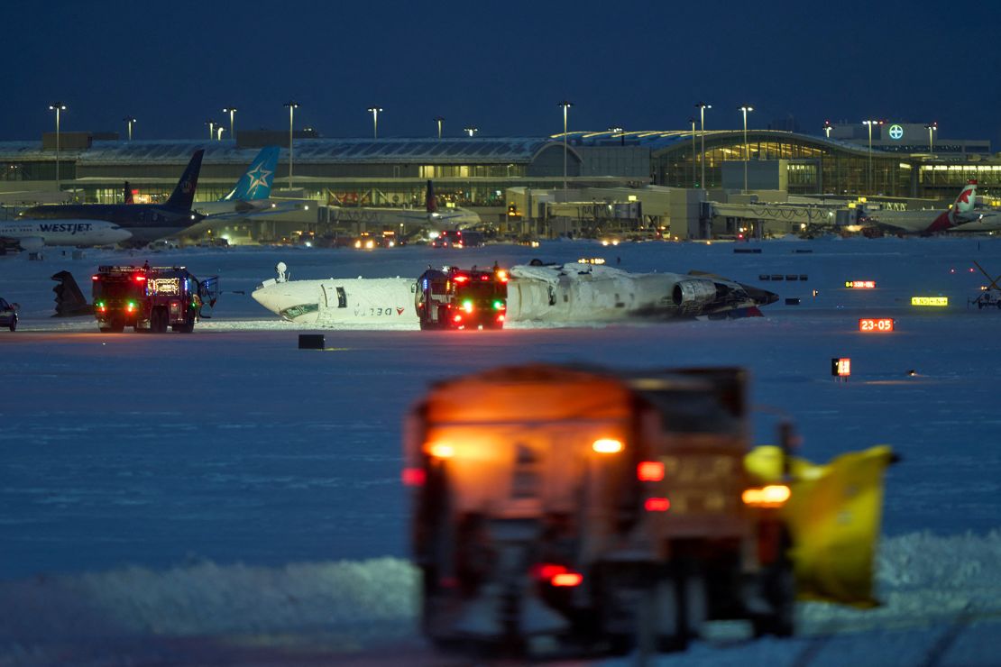 The Delta Air Lines plane is sitting on the roof after crashing when it landed at Toronto Pearson International Airport on Monday.