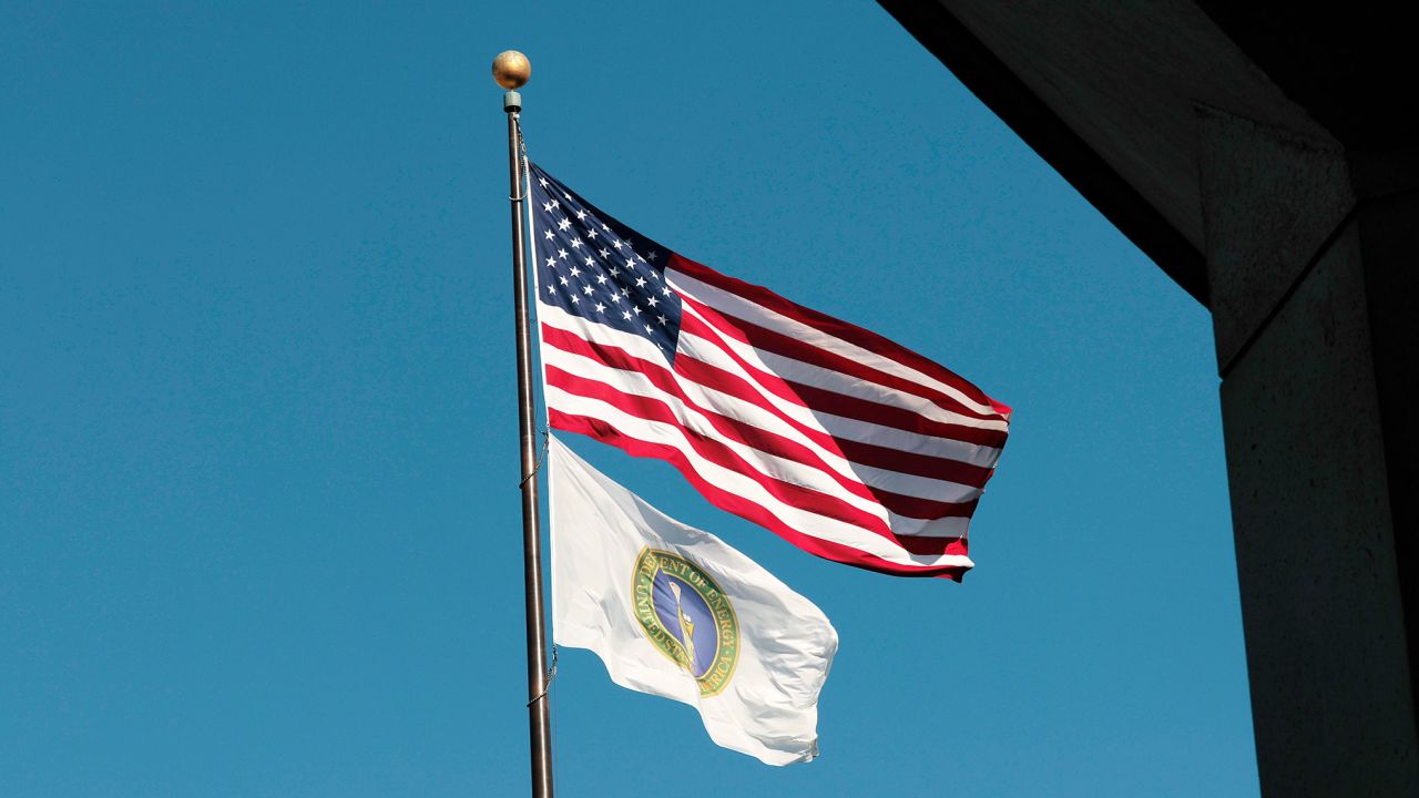 The US Department of Energy flags fly near the department's headquarters on February 14, 2025, in Washington, DC.