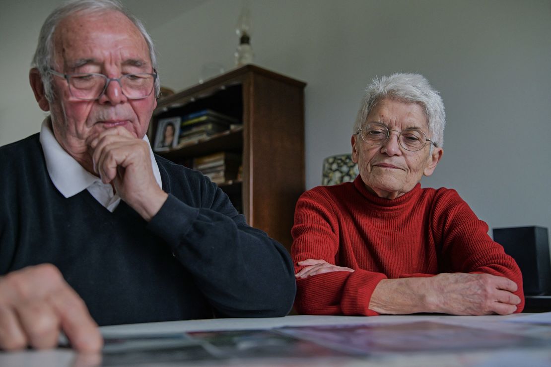 Roland and Mauricette Vinet look at photographs of their grandson Mathis, victim of Le Scouarnec when he was 10 years old, in Saint-Germain, Western France, on February 3, 2025. Mathis died of an overdose in 2021.