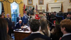 U.S. President Donald Trump speaks to the media after signing an executive in the Oval Office at the White House on February 14, 2025 in Washington, DC. President Trump signed a series of executive orders including announcing that his administration will withhold federal funding from schools and universities that impose COVID-19 vaccine mandates.