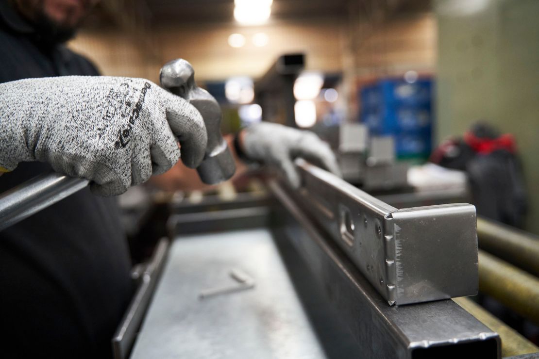 A worker inspects aluminum parts at an auto parts manufacturer in San Luis Potosi, Mexico.