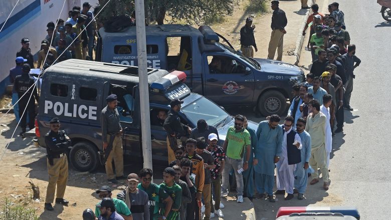 Spectators queue to enter the National Stadium in Karachi, Pakaistan on February 19, 2025, ahead of the ICC Champions Trophy one-day international cricket match between Pakistan and New Zealand.