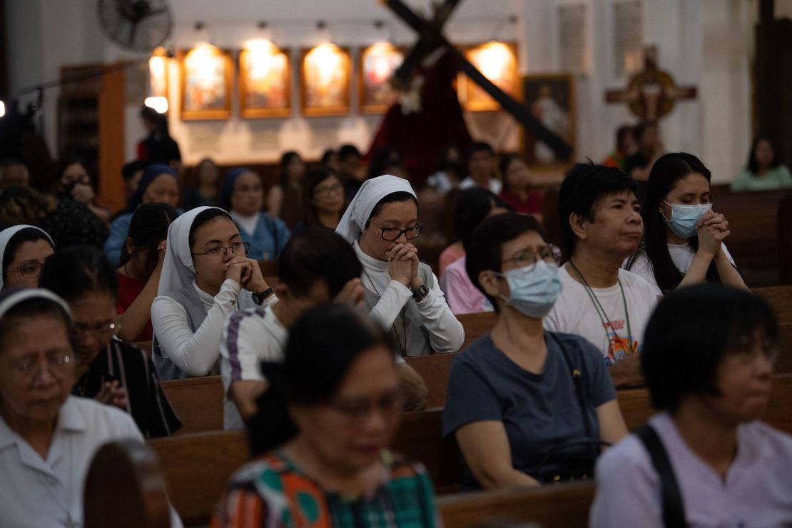 Catholics pray for Pope Francis at a church in Manila, Philippines on Thursday. Worshipers have gathered around the world to provide dedication to the restoration of the 88-year-old Pope.