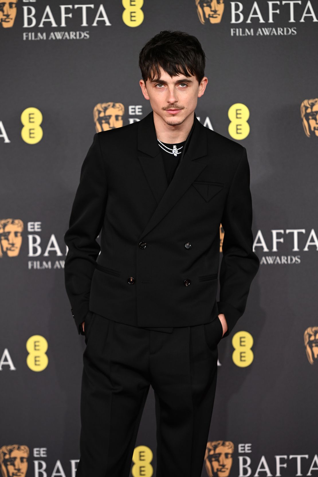 Back to black: Timothée Chalamet looked sharp in a Bottega Veneta suit.