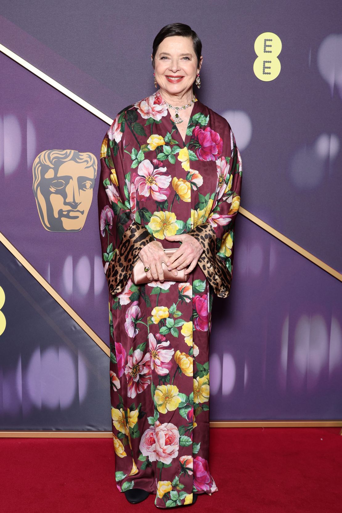 Isabella Rossellini's look by Dolce & Gabbana mixed florals with leopard print.