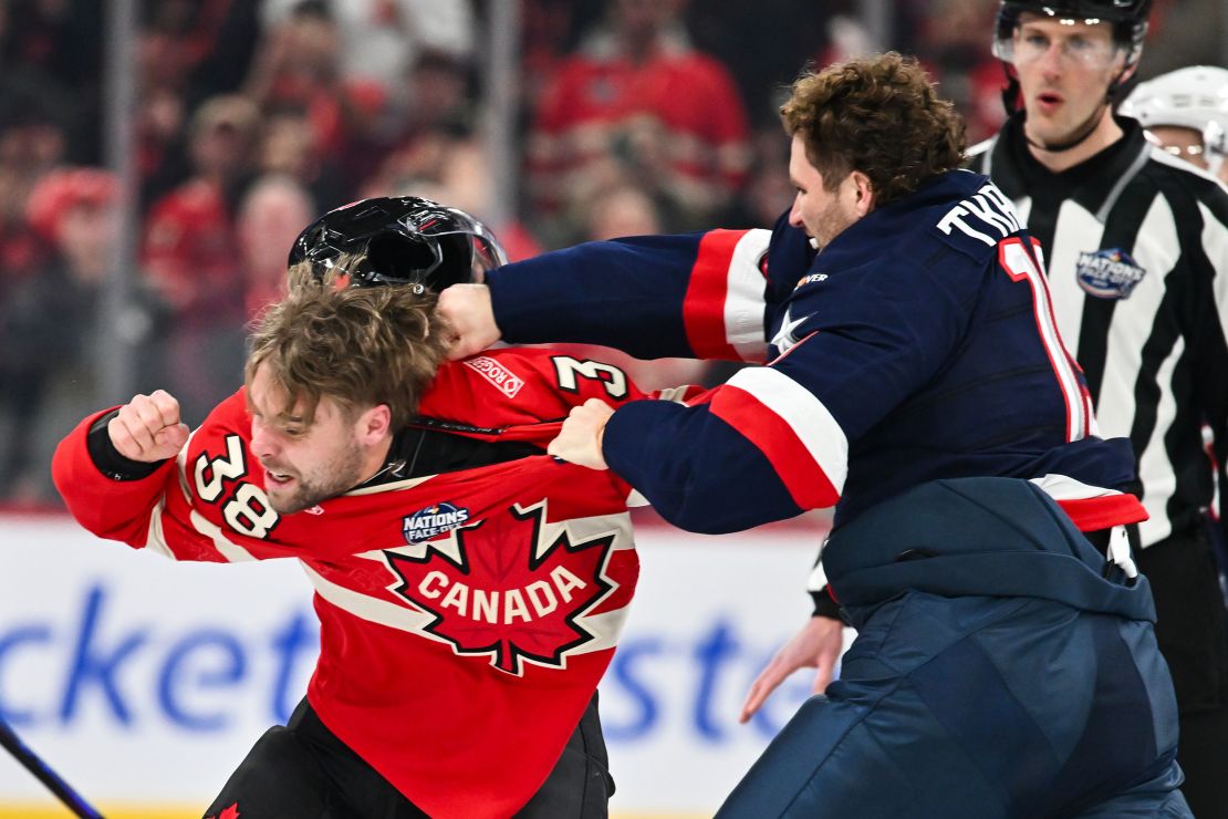 MONTREAL, CANADA - FEBRUARY 15:  Matthew Tkachuk #19 of Team USA and Brandon Hagel #38 of Team Canada fight in the first period during the 2025 NHL 4 Nations Face-Off at the Bell Centre on February 15, 2025 in Montreal, Quebec, Canada. Team USA defeated Team Canada 3-1.  (Photo by Minas Panagiotakis/Getty Images)