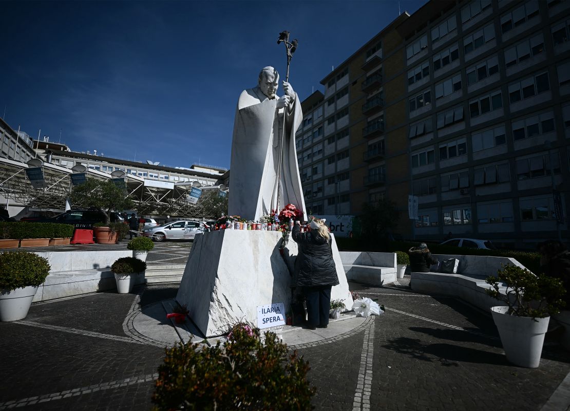 The woman will leave the rosary at the feet of the late Pope John Paul II outside the Agostino Gemeri Policicic in Rome, Italy on Friday. Pope Francis spent the seventh day there being treated for pneumonia.