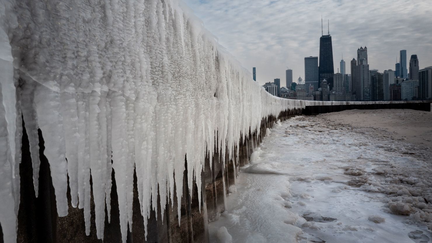 Ice collects along the shore of Lake Michigan on Monday as temperatures plunged in Chicago.