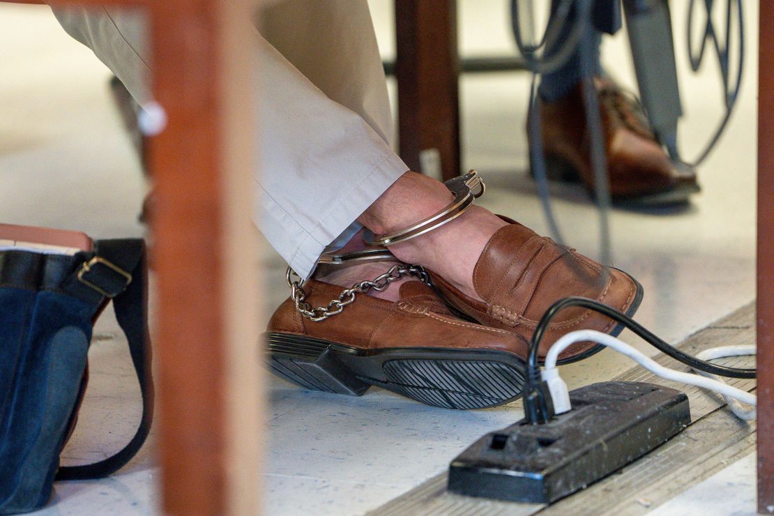 A view of the ankle cuffs and shoes worn by Luigi Mangione as he attends a hearing at Manhattan Criminal Court on February 21 in New York City.
