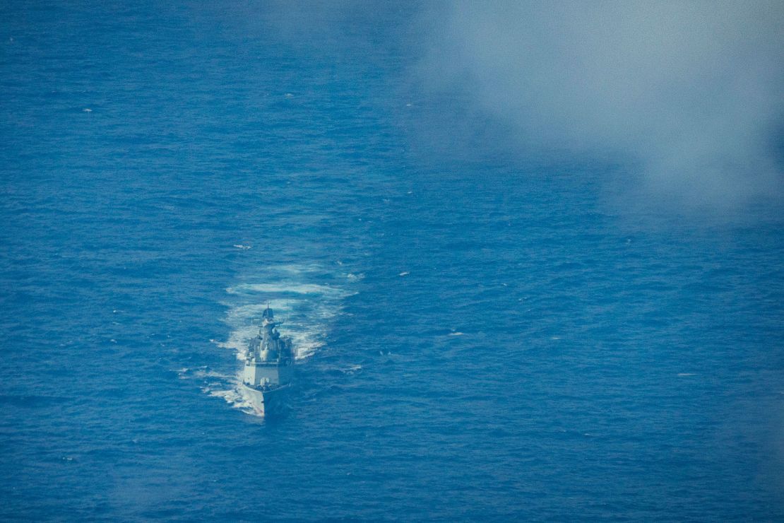 A Chinese naval warship sails near the waters of Scarborough Shoal in the South China Sea, as seen from aboard a Philippine Bureau of Fisheries and Aquatic Resources plane on February 18.