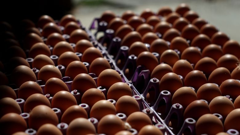 Freshly laid organic eggs sit stacked in a henhouse at Sunrise Farms on February 18, 2025 in Petaluma, California.