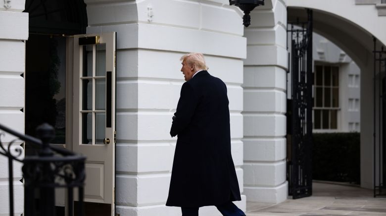 President Donald Trump walks to the Residence after arriving at the White House on February 22.