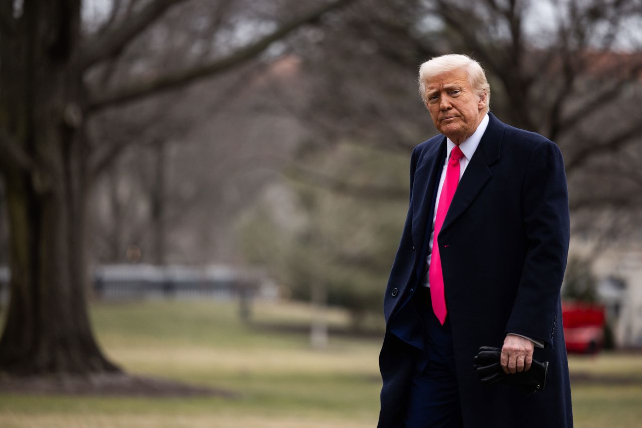 President Donald Trump walks to the Residence after arriving to the White House on Saturday.